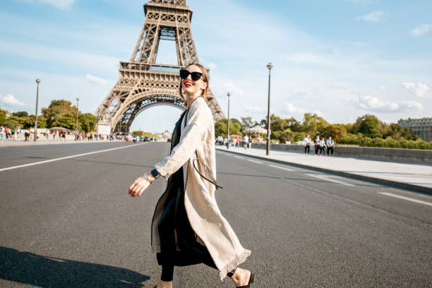 istock Woman walking near the Eiffel tower in Paris 1055603454
