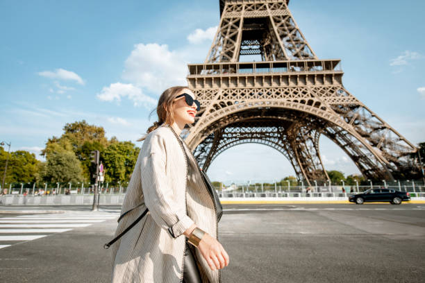 istock Woman walking near the Eiffel tower in Paris 1055603468