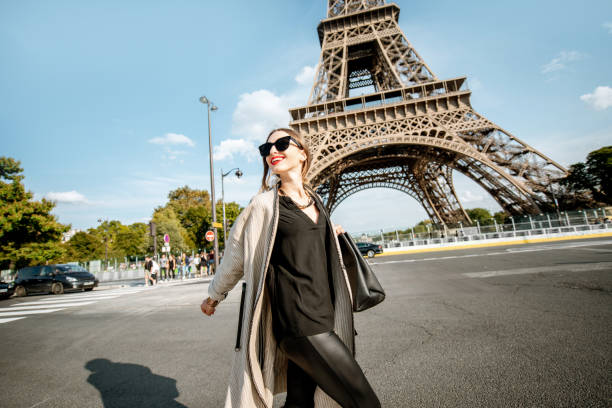 istock Woman walking near the Eiffel tower in Paris 1055603524