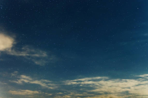 istock Night sky backgrounds with stars and clouds 1055603612