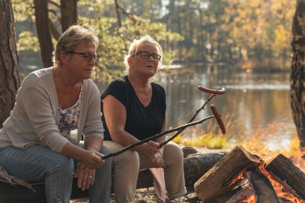 istock Senior ladies barbecuing outdoors 1055608020