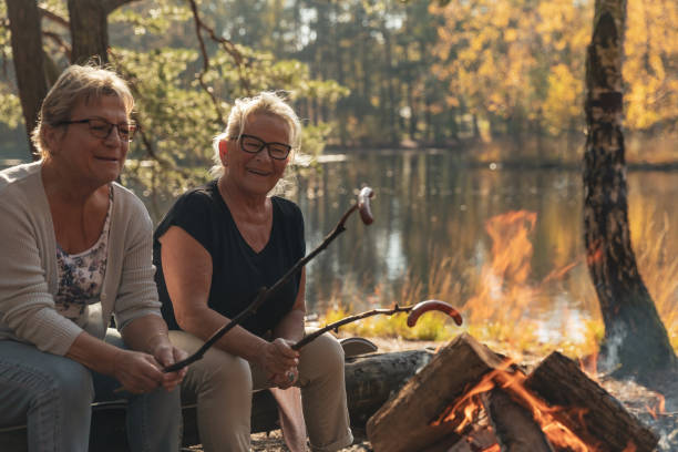istock Senior ladies barbecuing outdoors 1055608022