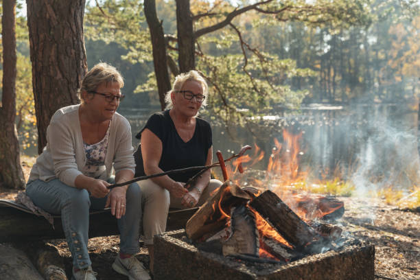 istock Senior ladies barbecuing outdoors 1055608056
