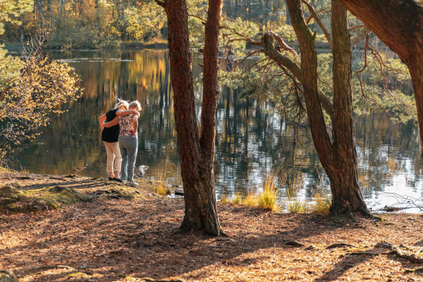 istock Senior ladies looking out over a lake 1055608440