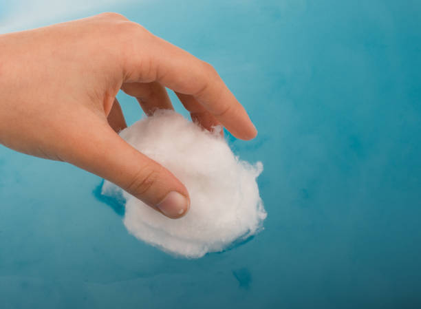 istock Hand holding some cotton in hand 1055614148
