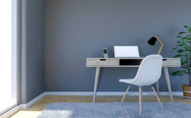 istock Contemporary living room interior with grey empty wall and working desk with laptop computer 1055614604