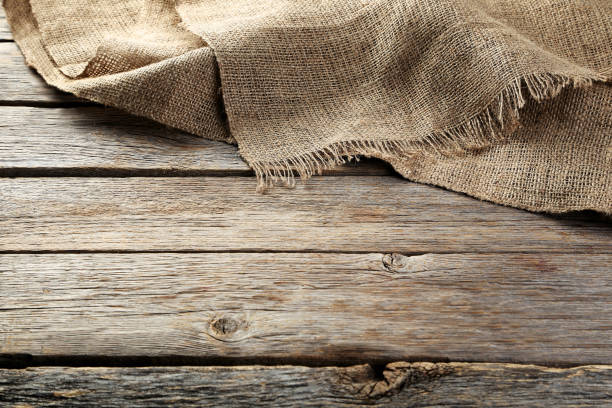 istock Sackcloth texture on gray wooden table 1055617480