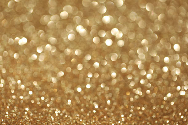 istock Beautiful golden bokeh background 1055619714