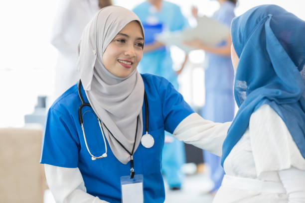 Nurse comforts female patient