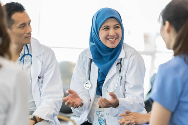 istock Doctor facilitates staff meeting 1055627832