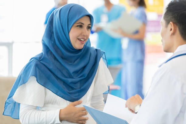 istock Pregnant woman talks with obstetrician 1055627846