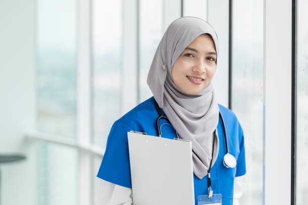 istock Confident female nurse 1055627850