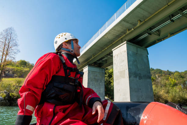 istock Firefighter in a rescue operation on a rubber boat on the river 1055628434