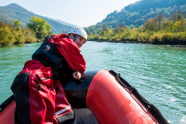 istock Firefighter in a rescue operation on a rubber boat on the river 1055628524