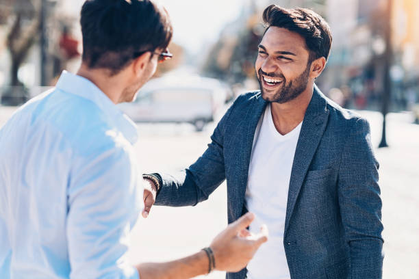 istock Two young men happy to meet each other 1055628628