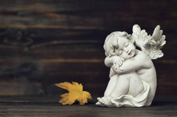 istock Guardian angel and autumn leaf 1055630442