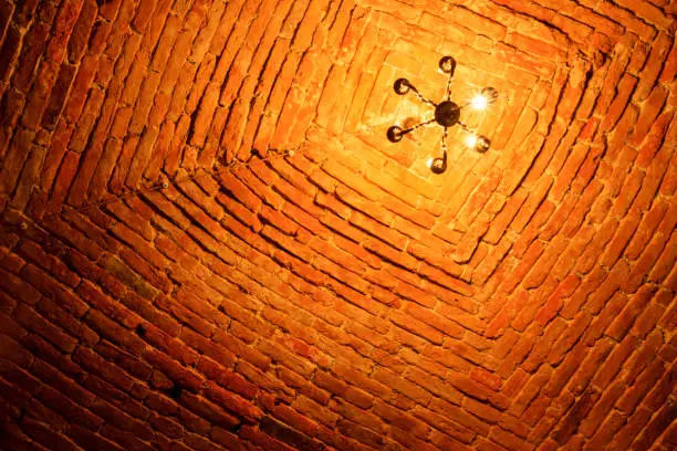 brick ceiling and a lamp on it, travel to europe