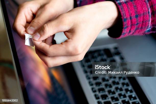 Close Up Hand Blocks The Webcam With A White Sticker Tape F Stock Photo - Download Image Now