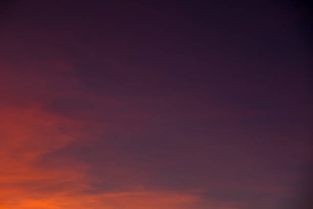 istock Sunset sky with purple sky and bright orange clouds, abstract background 1055643490