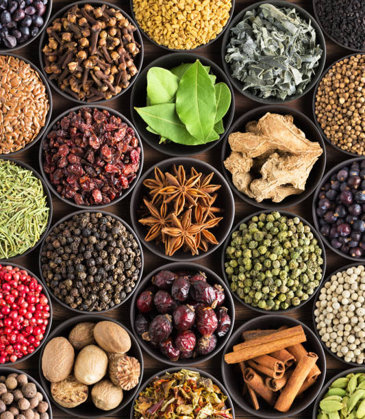 istock bright  spices and herbs in cups, top view. background for packing with European condiments. 1055645462