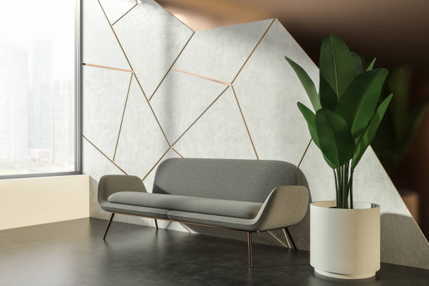 istock Gray sofa in white and brown living room corner 1055649900