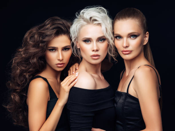 istock Three beautiful girls with a natural make-up 1055650346