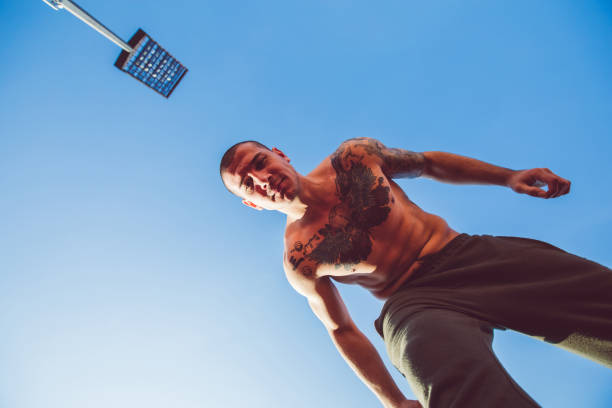 istock Man exercising on stadium race track 1055650614