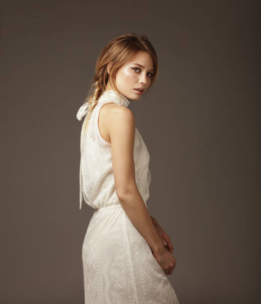 Portrait of young beautiful woman wearing lace dress stock photo