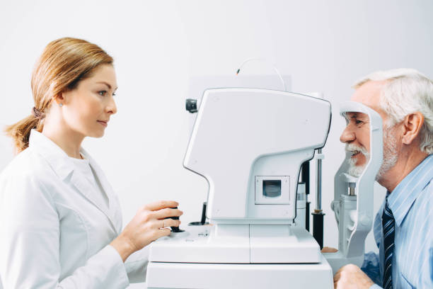 istock Senior man visiting optician, eye exam at clinic 1055656454