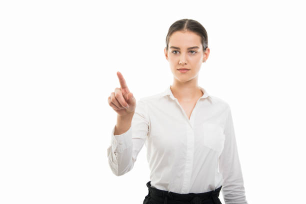 istock Young pretty bussines woman using invisible touchscreen gesture 1055658474