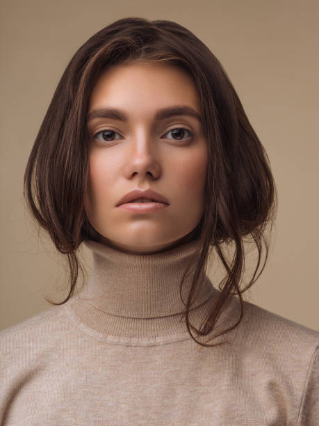 beautiful woman wearing sweater - hairstyle human hair women human face imagens e fotografias de stock