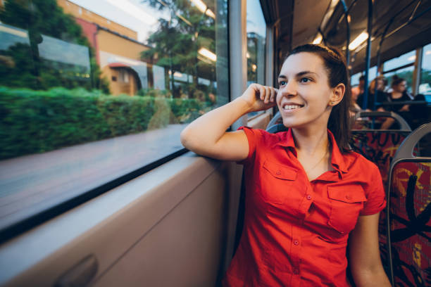 istock Young woman on a city bus ride 1055659928