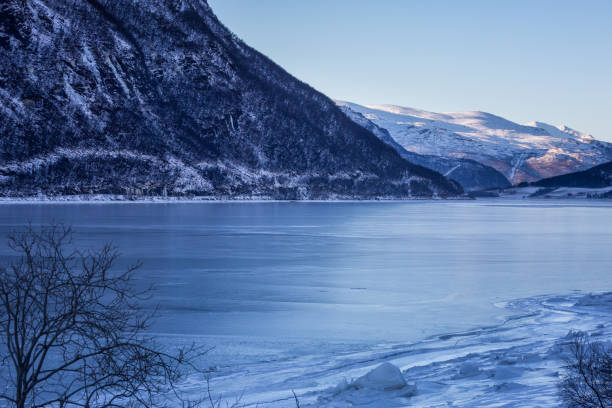 istock Winter landscape with mountains and sea, Norway 1055660136