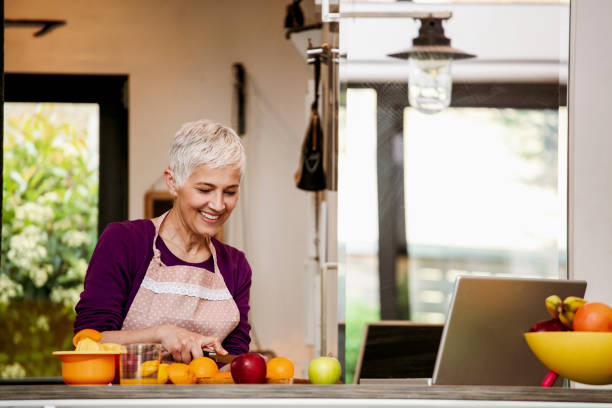 istock Family cooking together in cozy comfortable kitchen 1055664588