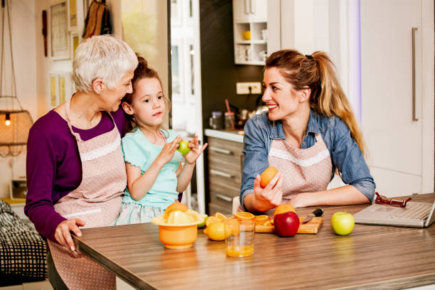 istock Family cooking together in cozy comfortable kitchen 1055665008