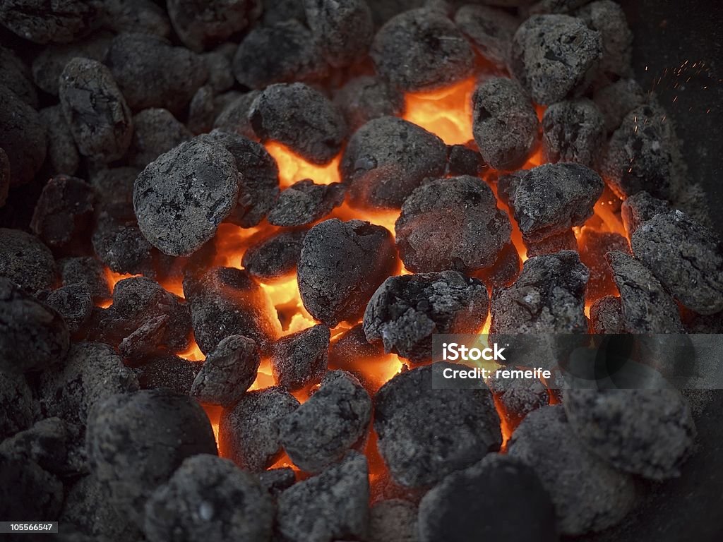 Charcoal on fire in a BBQ (barbeque) grill  Burning Stock Photo