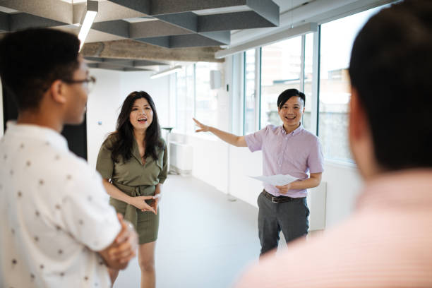 istock Multi-ethnic business team moving into new office 1055667162