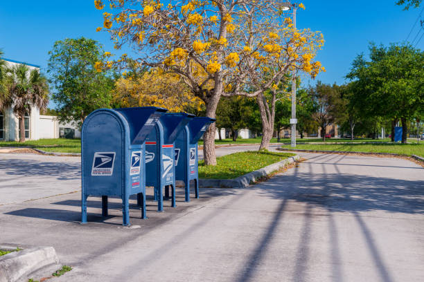 USPS Mail Boxes along the road in Florida City Florida USA Florida City, Florida, USA - March 30, 2015: USPS Mail Boxes along the road in Florida City, Florida, USA. United States Parcel Service, or US Mail, is responsible for providing postal service in the United States, including its insular areas and associated states. united states postal service photos stock pictures, royalty-free photos & images