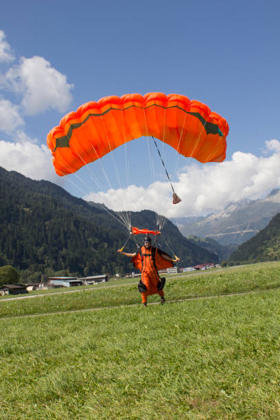 istock Paraglider walks toward camera after landing 1055668092