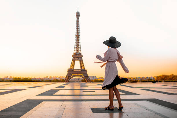 istock Woman on the square with beautiful view on the Eiffel tower in Paris 1055669634
