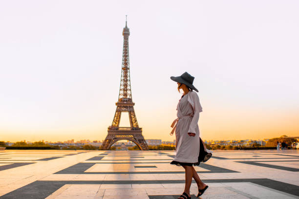 istock Woman on the square with beautiful view on the Eiffel tower in Paris 1055669636