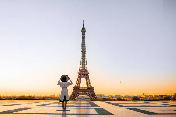 Woman on the square with beautiful view on the Eiffel tower in Paris