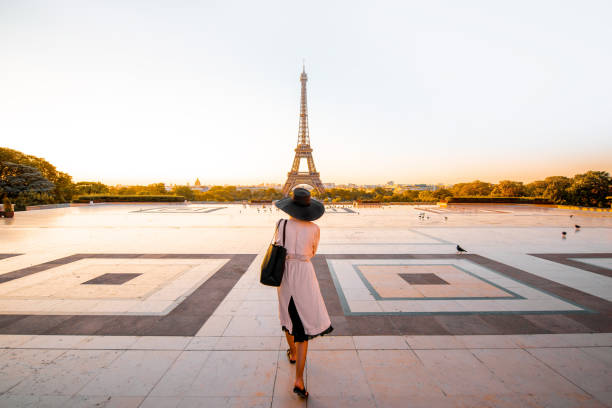 istock Woman on the square with beautiful view on the Eiffel tower in Paris 1055669680
