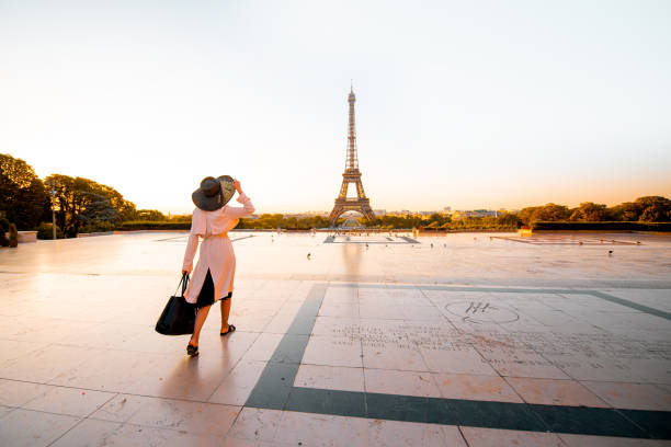 istock Woman on the square with beautiful view on the Eiffel tower in Paris 1055669682
