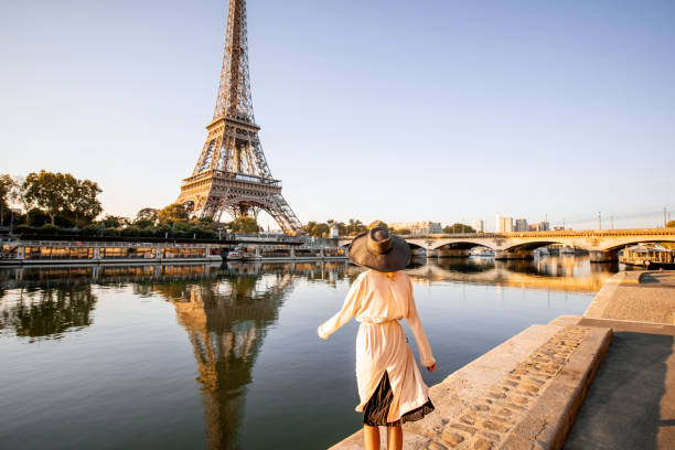 istock Woman enjoying Eiffel tower in Paris 1055669798