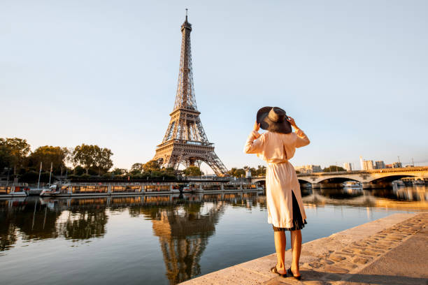 istock Woman enjoying Eiffel tower in Paris 1055669860