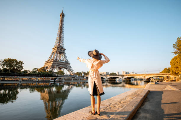 istock Woman enjoying Eiffel tower in Paris 1055669862