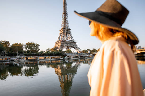 istock Woman enjoying Eiffel tower in Paris 1055669878