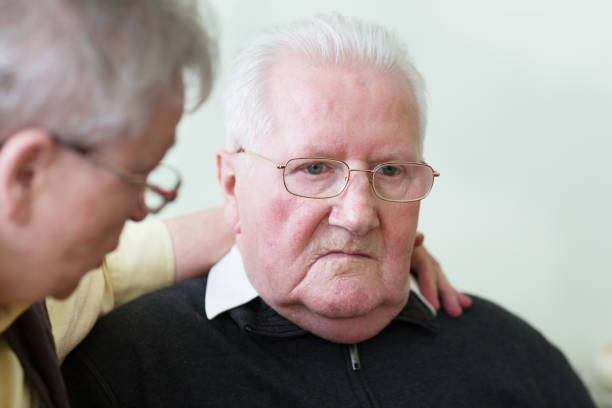 istock Kind care for senior man with dementia 1055669894