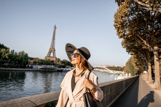 istock Woman walking in Paris with Eiffel tower on the background 1055669952